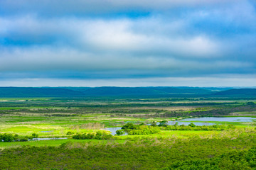 Obraz premium Kushiro Shitsugen national park in Hokkaido in summer day, view from Hosooka observation deck, the largest wetland in Japan. The park is known for its wetlands ecosystems