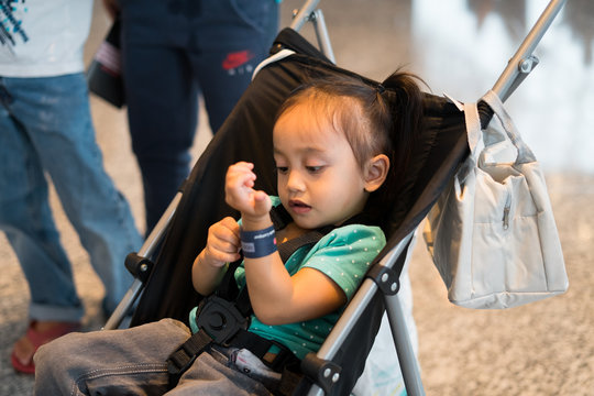 Toddler in stroller at The Malaysian Digital Fair in Malaysia International Trade and Exhibition Centre (Mitec).