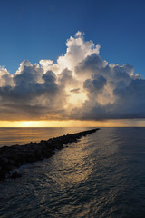 Obraz premium Sunrise on Miami Beach's South Beach, Florida under dramatic cloudscape.