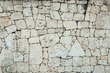 White, beige, gray stone texture wall, bricks, caliche template, background with copy space