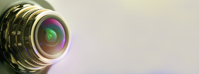 Banner. Close-up grey camera lens with illumination. Optics