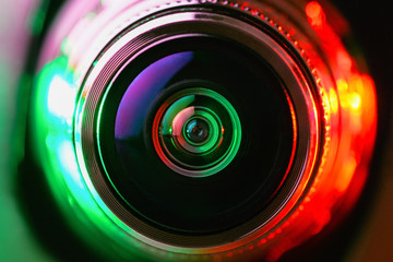 Close-up camera lens with green and red backlight. Optics. Gorizontal photo