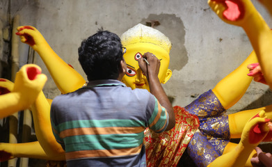 Local artist working on Goddess Durga idol at Kumartuli Kolkata for the Durga Puja festival