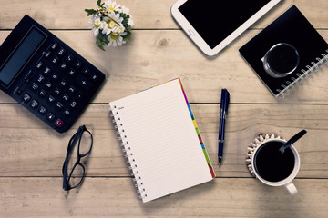 note book with  pen and office equipment on desktop