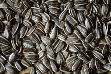 Background made of seeds. Seeds are striped on the table. top view