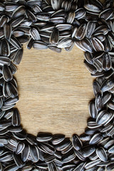 Frame of sunflower seeds. Seeds laid out on the table. copy space, top view, flat lay, background with blank space for text