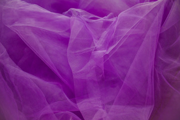 The texture of purple tulle. Fabric mesh. copy space, top view, flat lay,