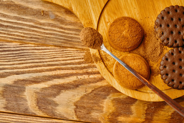 A pile of cookies and a spoonful of cocoa. Flatlay autumn concept