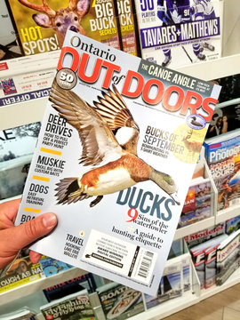 Out of Doors magazine in a hand