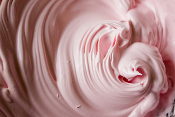 Pink protein cream in a bowl. ingredient for the cake. culinary background with blank space for text