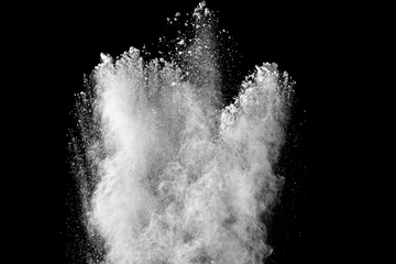 Gordijnen White powder explosion clouds.Freeze motion of white dust particles on black background. © Pattadis