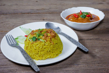 cooked turmeric jasmine rice with chicken massaman curry
