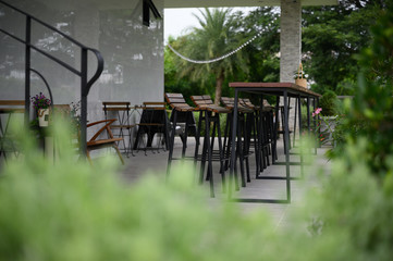 Cozy design chair and table in the garden; natural feeling