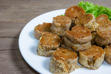  Deep Fried Crab meat roll or Hoi jo on wood  background