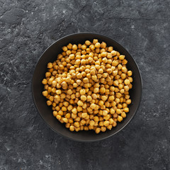 Cooking chickpeas bowl dark stone background top view