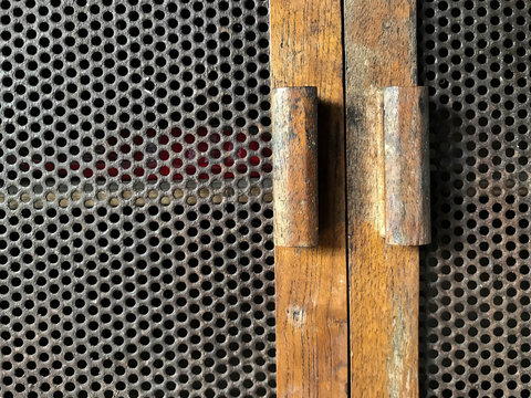 Close up door vintage , door with honeycomb, Close up Antique wooden old cabinet door with holes honeycomb, honeycomb on wood pattern, texture and background, door wooden cabinet
