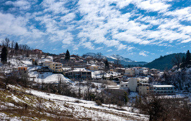 Fototapeta premium Snowy landscapes. view of Village in Lake Plastira on winter. Greece. 