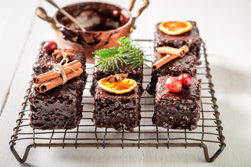Gingerbread cubes for Christmas with ingredients on white table