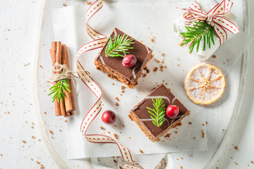 Gingerbread cake for Christmas with jam on white table