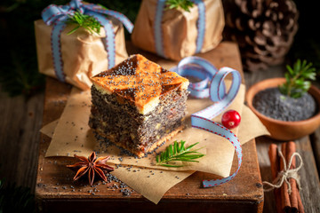 Closeup of poppy seed cake for Christmas on wooden table