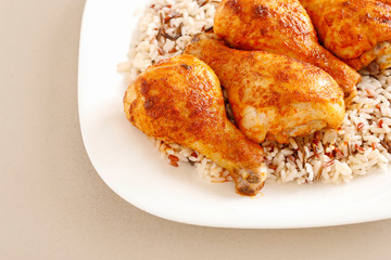Indian cuisine: roasted chicken with rice and vegetables.