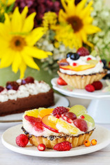 Colorful cupcakes with fresh fruits.
