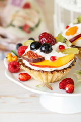 Colorful cupcakes with fresh fruits.