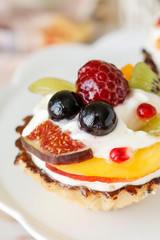 Colorful cupcakes with fresh fruits.