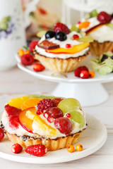 Colorful cupcakes with fresh fruits.
