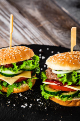 Tasty burgers served black stone plate