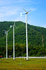 Fototapeta na wymiar wind turbines in green field