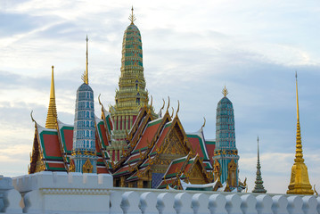 Naklejka premium Fragment of the old Grand Royal Palace on evening twilight. Bangkok, Thailand