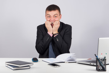 Naklejka premium Expressive corporate man concept-Scared manager biting his nails