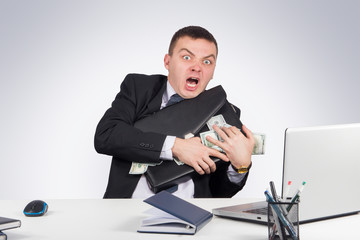 Businessman with a briefcase full of money in the hands