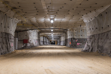 exploitation hollow with the modern mesh on the ceiling in copper mine.