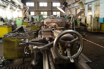Fototapeta premium Metalworking workshop, metal processing machines. Levers of control of the machine.