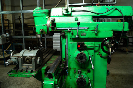 Metalworking workshop, metal processing machines. Levers of control of the machine.