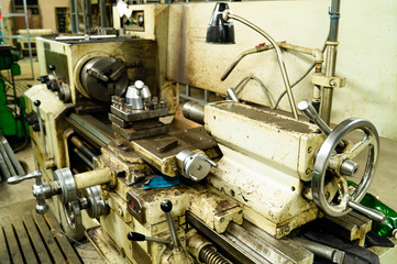 Metalworking workshop, metal processing machines. Levers of control of the machine.