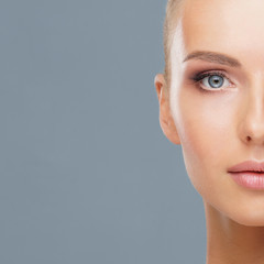 Attractive face of beautiful girl. Close-up portrait of healthy woman. Skin care, cosmetics,...
