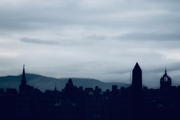 Silhouette of Edinburgh City skyline against grey sky