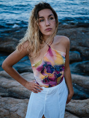 closeup portrait of seductive attractive young blonde woman in colorful shirt silk hand painted