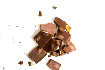 chocolate pieces pile with almonds isolated