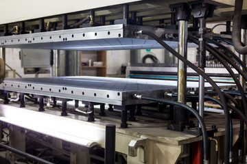 Thickness calibration table lightweight polycarbonate sheets and solid polycarbonate as part of the production factory line.