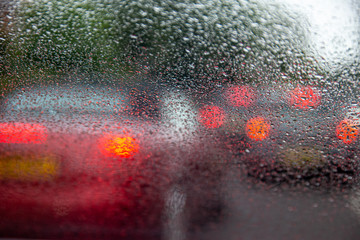 Driving with heavy rain on car windscreen