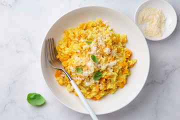 Pumpkin risotto in white bowl