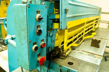  Metalworking workshop, metal processing machines. Levers of control of the machine. Equipment installed in the workshop, closeup management tools.