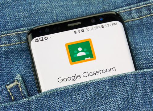 Google Classroom on a phone screen in a pocket