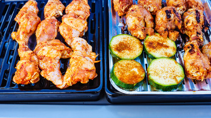 Chicken meat grilling on gas grill