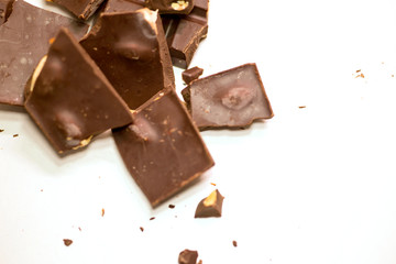 chocolate pieces pile with almonds isolated