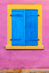 Colorful house in Bamberg, Germany. Window in happy, bright mediterranean colors. Travel, fun, joy concept